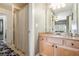Bathroom featuring a single sink vanity, carpet and a shower with curtain at 3227 Aviary Nw Ct, Acworth, GA 30101