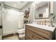 Bathroom with white subway tile shower, a frosted glass door, and wood-look flooring at 3227 Aviary Nw Ct, Acworth, GA 30101