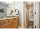 Well-lit bathroom featuring vanity, framed mirror, and shower at 3227 Aviary Nw Ct, Acworth, GA 30101