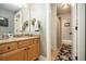 Bathroom featuring a single sink vanity and a shower with curtain behind a doorway at 3227 Aviary Nw Ct, Acworth, GA 30101