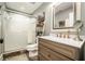 Bathroom featuring a glass enclosed shower, a decorative ladder, a framed mirror, and a wood vanity at 3227 Aviary Nw Ct, Acworth, GA 30101