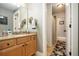 Bright bathroom with a large vanity, mirror, and plenty of storage space at 3227 Aviary Nw Ct, Acworth, GA 30101