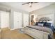 Cozy bedroom with carpet, ceiling fan, and queen size bed at 3227 Aviary Nw Ct, Acworth, GA 30101