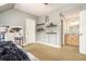 Bedroom with open shelving, a world map, and an adjoining bathroom with natural wood vanity at 3227 Aviary Nw Ct, Acworth, GA 30101