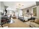 Spacious bedroom with a comfortable bed, desk area, and plenty of natural light at 3227 Aviary Nw Ct, Acworth, GA 30101