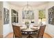 Sunlit breakfast nook with a round table and views of the backyard at 3227 Aviary Nw Ct, Acworth, GA 30101
