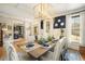 Elegant dining room showcasing a modern chandelier and stylish decor; perfect for entertaining guests at 3227 Aviary Nw Ct, Acworth, GA 30101