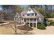 Beautiful home showcasing a well-maintained lawn, attractive landscaping, and traditional architectural design at 3227 Aviary Nw Ct, Acworth, GA 30101
