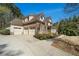 Spacious three-car garage and a well-maintained lawn complement this charming home at 3227 Aviary Nw Ct, Acworth, GA 30101