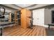 Another angle of the home gym, showcasing a sauna, bench, and exercise bike at 3227 Aviary Nw Ct, Acworth, GA 30101