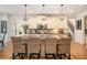 Well-lit kitchen with granite countertops, stainless steel appliances, and decorative hanging lights above a large island at 3227 Aviary Nw Ct, Acworth, GA 30101