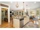 Open kitchen with stainless steel appliances, island, and breakfast area at 3227 Aviary Nw Ct, Acworth, GA 30101