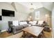 Living room with carpet, gray sofa, coffee table, and mounted television at 3227 Aviary Nw Ct, Acworth, GA 30101