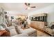 Large living room with vaulted ceilings, hardwood floors, and a built-in aquarium at 3227 Aviary Nw Ct, Acworth, GA 30101