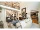 Bright and spacious living room with soaring ceilings, a fireplace, and a staircase to the second floor at 3227 Aviary Nw Ct, Acworth, GA 30101