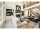 Cozy living room with a fireplace, built-in bookshelves, and comfortable seating; great for relaxation at 3227 Aviary Nw Ct, Acworth, GA 30101