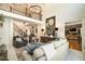Spacious living room with a soaring ceiling, large windows, and stylish furnishings at 3227 Aviary Nw Ct, Acworth, GA 30101