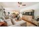 Open concept living area with a large sofa and unique aquarium feature at 3227 Aviary Nw Ct, Acworth, GA 30101