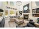 Inviting living room with a fireplace, large windows, and comfortable seating; ideal for relaxation at 3227 Aviary Nw Ct, Acworth, GA 30101