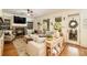Comfortable living room with a stone fireplace, a plush sectional sofa, and plenty of natural light at 3227 Aviary Nw Ct, Acworth, GA 30101