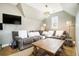 Living room featuring a comfortable sectional sofa, large window, and a TV at 3227 Aviary Nw Ct, Acworth, GA 30101