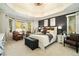Beautiful main bedroom suite featuring a tray ceiling, natural light and a sitting area at 3227 Aviary Nw Ct, Acworth, GA 30101