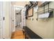 Functional mudroom with bench seating, storage baskets, and access to the laundry room at 3227 Aviary Nw Ct, Acworth, GA 30101