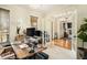 Home office featuring a hardwood desk, large windows, and natural light at 3227 Aviary Nw Ct, Acworth, GA 30101