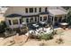 Outdoor patio area with multiple seating areas, a hot tub, fire pit and lovely landscaping at 3227 Aviary Nw Ct, Acworth, GA 30101