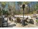 Backyard has an outdoor stone seating area with heaters for cozy gathering and relaxation at 3227 Aviary Nw Ct, Acworth, GA 30101