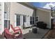 Inviting back patio with comfortable seating area and grill at 4927 Magnolia Cottage Way, Acworth, GA 30101