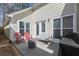 Inviting back patio with comfortable seating area and grill at 4927 Magnolia Cottage Way, Acworth, GA 30101
