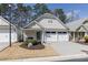 Inviting home with a two-car garage, tidy landscaping, and a cozy front entrance at 4927 Magnolia Cottage Way, Acworth, GA 30101