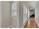 Bright hallway with hardwood floors and large windows offering ample natural light at 4927 Magnolia Cottage Way, Acworth, GA 30101