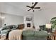 Bright living room with a fireplace, vaulted ceiling, hardwood floors, and modern décor at 4927 Magnolia Cottage Way, Acworth, GA 30101