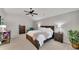 Spacious main bedroom featuring a ceiling fan, neutral decor, and comfortable furnishings at 4927 Magnolia Cottage Way, Acworth, GA 30101
