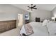 Spacious main bedroom featuring a ceiling fan, neutral decor, and comfortable furnishings at 4927 Magnolia Cottage Way, Acworth, GA 30101