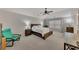Spacious main bedroom with neutral walls, plush carpeting, ceiling fan, and ample natural light at 4927 Magnolia Cottage Way, Acworth, GA 30101