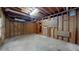 Unfinished basement with exposed wooden framing, and concrete flooring at 993 Castle Falls Dr. Ne Dr, Atlanta, GA 30329