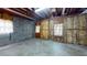Basement with cinderblock wall, exposed wood framing, concrete floor, and window at 993 Castle Falls Dr. Ne Dr, Atlanta, GA 30329