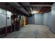 Unfinished basement, some walls are paneled, with exposed pipes, and concrete floor at 993 Castle Falls Dr. Ne Dr, Atlanta, GA 30329