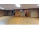 Large basement with a staircase, access door, paneled walls, and tile floors at 993 Castle Falls Dr. Ne Dr, Atlanta, GA 30329