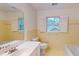 Retro bathroom featuring vintage tile, toilet, sink, and bathtub. Offers a classic and clean design at 993 Castle Falls Dr. Ne Dr, Atlanta, GA 30329