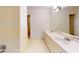 Bright bathroom with a double sink vanity, shower/tub combination, and cream tiling extending down the walls at 993 Castle Falls Dr. Ne Dr, Atlanta, GA 30329