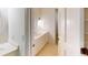 Bright bathroom featuring a white vanity with sink, round mirror, and classic lighting at 993 Castle Falls Dr. Ne Dr, Atlanta, GA 30329