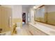 Bright bathroom with a double vanity, classic yellow tile, and ample lighting at 993 Castle Falls Dr. Ne Dr, Atlanta, GA 30329