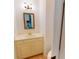 Powder room features an elegant mirror, sink, and vanity with a tiled floor at 993 Castle Falls Dr. Ne Dr, Atlanta, GA 30329
