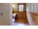 Bathroom featuring a sink, toilet, and window providing natural light at 993 Castle Falls Dr. Ne Dr, Atlanta, GA 30329