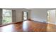 Spacious bedroom with hardwood floors and large windows offering great natural light at 993 Castle Falls Dr. Ne Dr, Atlanta, GA 30329