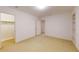 Spacious bedroom features neutral carpet and is connected to another room through an open doorway at 993 Castle Falls Dr. Ne Dr, Atlanta, GA 30329